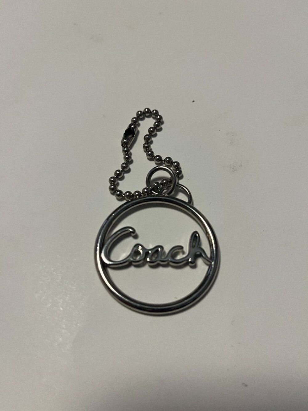 COACH Silver-tone Coach Round Metal Bag Charm